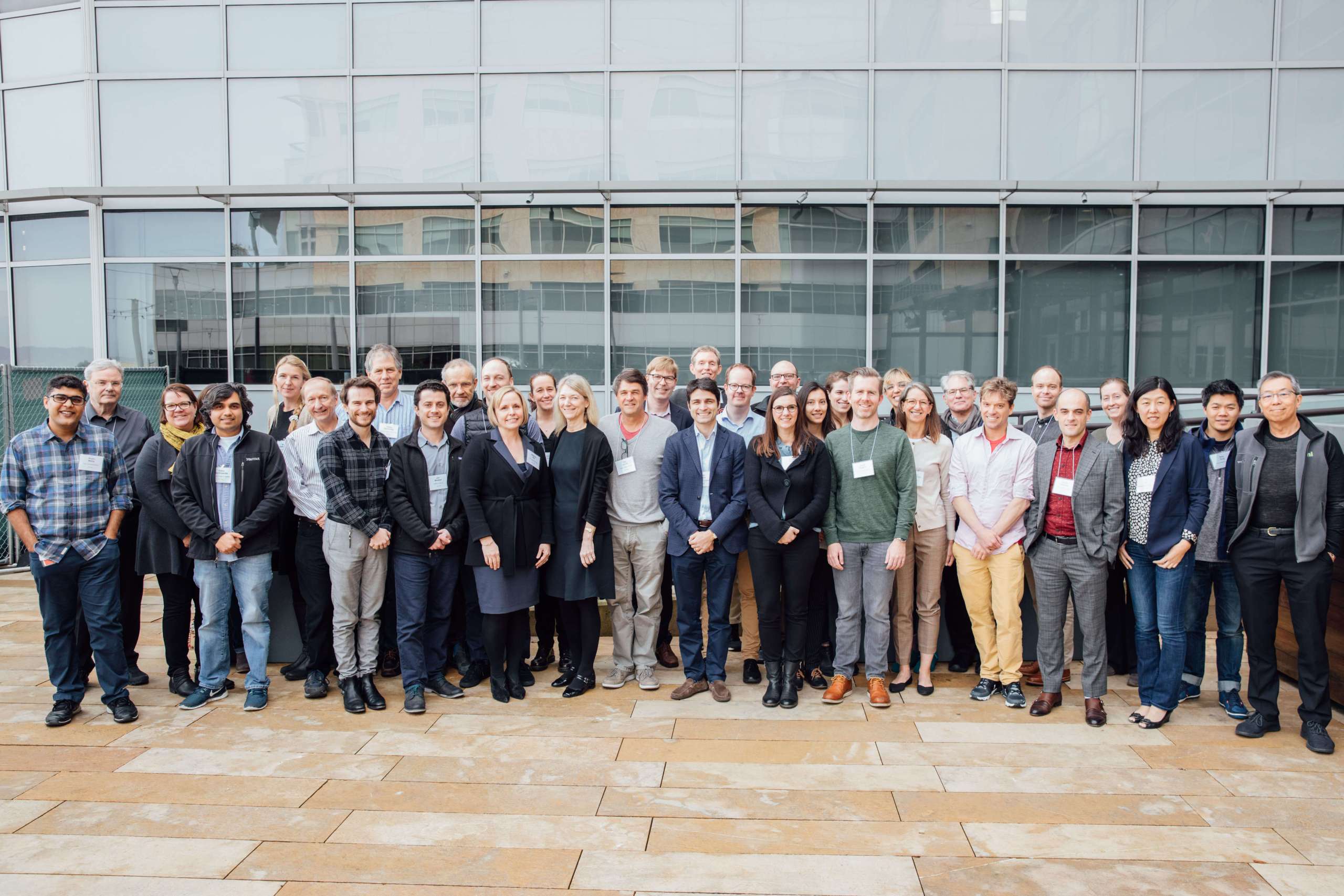 A group of attendees at the CZI Frontiers of Imaging workshop pose for a photo