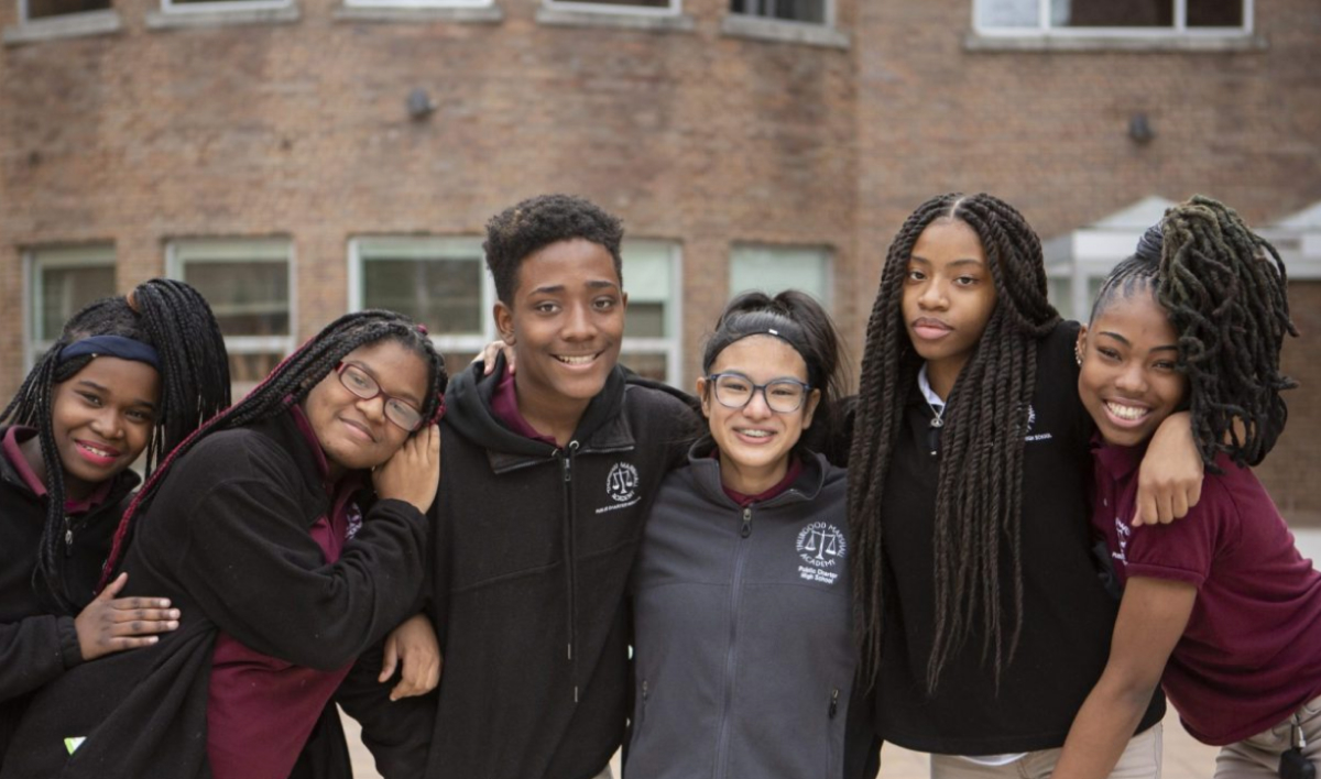Six students pose together outside Thurgood Marshall Academy in Washington, D.C. (Whole Child, Education, CZI).