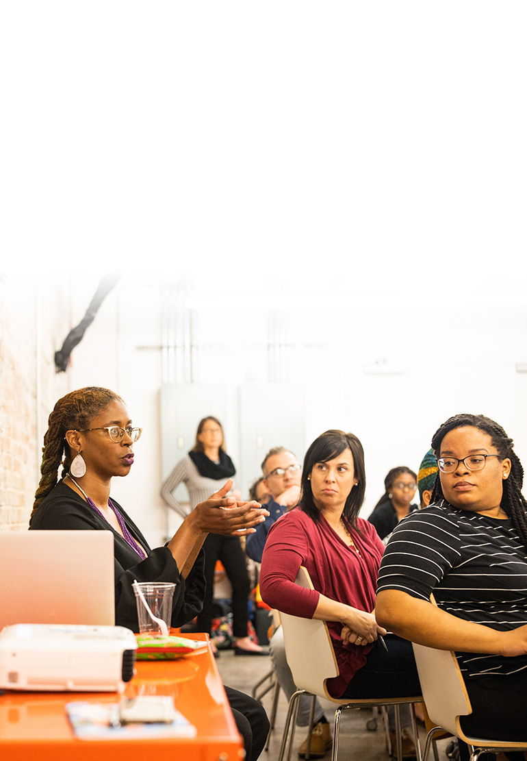 woman speaking to a room of trainees