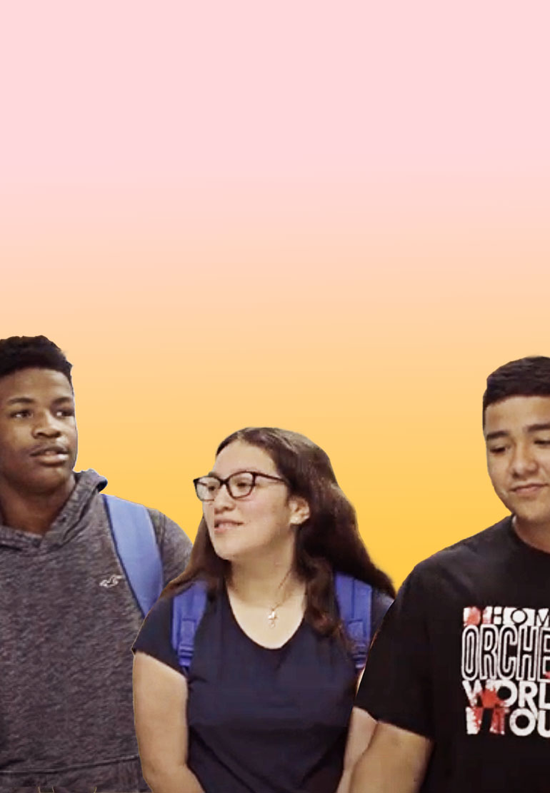 Three students standing together on a warm-colored background.